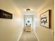 Hallway with neutral walls, carpet, and decorative wall art at 6701 Se 99Th Pl, Belleview, FL 34420