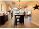 Open kitchen featuring a center island with seating overlooking the spacious living room at 6701 Se 99Th Pl, Belleview, FL 34420