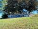 Stone sign marking the entrance to Golf Park at 6701 Se 99Th Pl, Belleview, FL 34420