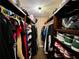 Spacious walk-in closet with built-in shelving for ample storage at 6701 Se 99Th Pl, Belleview, FL 34420