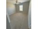 Bright bedroom with ceiling fan and window at 73 Fir Dr, Ocala, FL 34472
