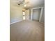 Bedroom with ceiling fan and closet at 73 Fir Dr, Ocala, FL 34472