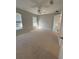 Large bedroom with carpet floors and ceiling fan at 73 Fir Dr, Ocala, FL 34472