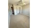 Spacious bedroom with ceiling fan and closet at 73 Fir Dr, Ocala, FL 34472
