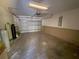 Attached garage with concrete floor at 73 Fir Dr, Ocala, FL 34472