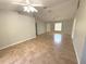 Spacious living room with tile floors and ceiling fans at 73 Fir Dr, Ocala, FL 34472