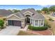 One-story house with a two-car garage and well-manicured lawn at 7358 Sw 101St Ave, Ocala, FL 34481
