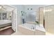 Spa-like bathroom with soaking tub, shower and window at 7358 Sw 101St Ave, Ocala, FL 34481