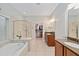 Bathroom with soaking tub, walk-in shower, and double vanity at 7358 Sw 101St Ave, Ocala, FL 34481