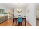 Formal dining room with dark wood table and blue chairs at 7358 Sw 101St Ave, Ocala, FL 34481