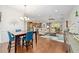Bright dining room with hardwood floors and seating for four at 7358 Sw 101St Ave, Ocala, FL 34481