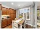 Kitchen nook features wood table, chairs, hardwood floors and wood cabinets at 7358 Sw 101St Ave, Ocala, FL 34481