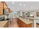 Long kitchen with stainless steel appliances and granite countertops at 7358 Sw 101St Ave, Ocala, FL 34481