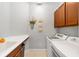 Laundry room with washer, dryer, and a utility sink at 7358 Sw 101St Ave, Ocala, FL 34481