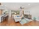 Spacious living room with hardwood floors and access to backyard at 7358 Sw 101St Ave, Ocala, FL 34481