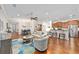 Open living area with hardwood floors, ceiling fan and view to kitchen at 7358 Sw 101St Ave, Ocala, FL 34481