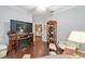 Office with fireplace, built-in shelving, and comfortable seating at 7358 Sw 101St Ave, Ocala, FL 34481