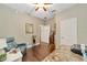Home office with wood floors, desk, and comfortable seating at 7358 Sw 101St Ave, Ocala, FL 34481