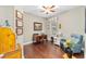 Home office with wood floors, desk, and comfortable seating at 7358 Sw 101St Ave, Ocala, FL 34481