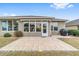 Spacious patio with pavers, adjacent to house and grill at 7358 Sw 101St Ave, Ocala, FL 34481