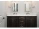 Double vanity bathroom with dark wood cabinets and quartz countertop at 7647 Nw 33Rd Pl, Ocala, FL 34482