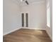 Bright bedroom with hardwood floors and mirrored doors at 7647 Nw 33Rd Pl, Ocala, FL 34482