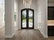 Grand entry with ornate double doors and hardwood floors at 7647 Nw 33Rd Pl, Ocala, FL 34482