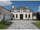 Elegant home features a gray stone driveway and manicured lawn at 7647 Nw 33Rd Pl, Ocala, FL 34482