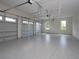 Spacious three-car garage with epoxy flooring at 7647 Nw 33Rd Pl, Ocala, FL 34482
