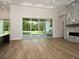 Gathering room with sliding doors leading to outdoor patio at 7647 Nw 33Rd Pl, Ocala, FL 34482