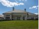 House exterior view showcasing the backyard and landscaping at 7647 Nw 33Rd Pl, Ocala, FL 34482