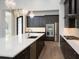 Modern kitchen with stainless steel appliances and expansive island at 7647 Nw 33Rd Pl, Ocala, FL 34482
