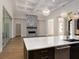 Open floor plan with kitchen, island, and fireplace at 7647 Nw 33Rd Pl, Ocala, FL 34482