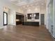 Spacious kitchen with island, stainless steel appliances, and hardwood floors at 7647 Nw 33Rd Pl, Ocala, FL 34482