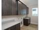 Laundry room with dark wood cabinets and quartz countertop at 7647 Nw 33Rd Pl, Ocala, FL 34482