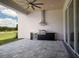 Outdoor kitchen with stainless steel appliances and paver patio at 7647 Nw 33Rd Pl, Ocala, FL 34482
