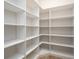 Large walk-in pantry with white shelving at 7647 Nw 33Rd Pl, Ocala, FL 34482