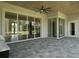 Covered patio with sliding glass doors and ceiling fan at 7647 Nw 33Rd Pl, Ocala, FL 34482