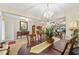 Elegant dining room showcasing a formal table setting and chandelier at 8160 Sw 92Nd Cir, Ocala, FL 34481