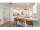 Kitchen with granite countertop island and tan leather barstools at 8310 Sw 79Th Cir, Ocala, FL 34481