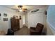 Relaxing bedroom with ceiling fan, double closet and comfortable armchair at 8512 Sw 107Th Pl, Ocala, FL 34481