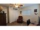 Bright bedroom with ceiling fan, double closet, and workspace at 8512 Sw 107Th Pl, Ocala, FL 34481