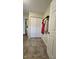 Spacious coat closet with built-in shelving and tile flooring at 8512 Sw 107Th Pl, Ocala, FL 34481