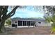Rear view of home with screened porch and landscaping at 8512 Sw 107Th Pl, Ocala, FL 34481