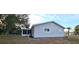 Side view of home with screened porch and landscaping at 8512 Sw 107Th Pl, Ocala, FL 34481