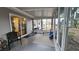 Relaxing screened porch with room for seating and exercise equipment at 8512 Sw 107Th Pl, Ocala, FL 34481