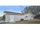 Side view of home showing the door, windows, and exterior siding at 8512 Sw 107Th Pl, Ocala, FL 34481