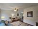 Spacious living room with wood-look floors, ceiling fan, and comfortable seating at 8512 Sw 107Th Pl, Ocala, FL 34481