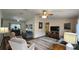 Inviting living room features a ceiling fan, an area rug, and comfortable seating at 8512 Sw 107Th Pl, Ocala, FL 34481