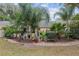 Landscaped backyard with tropical plants and stone pathway at 8723 Sw 93Rd Ln # C, Ocala, FL 34481